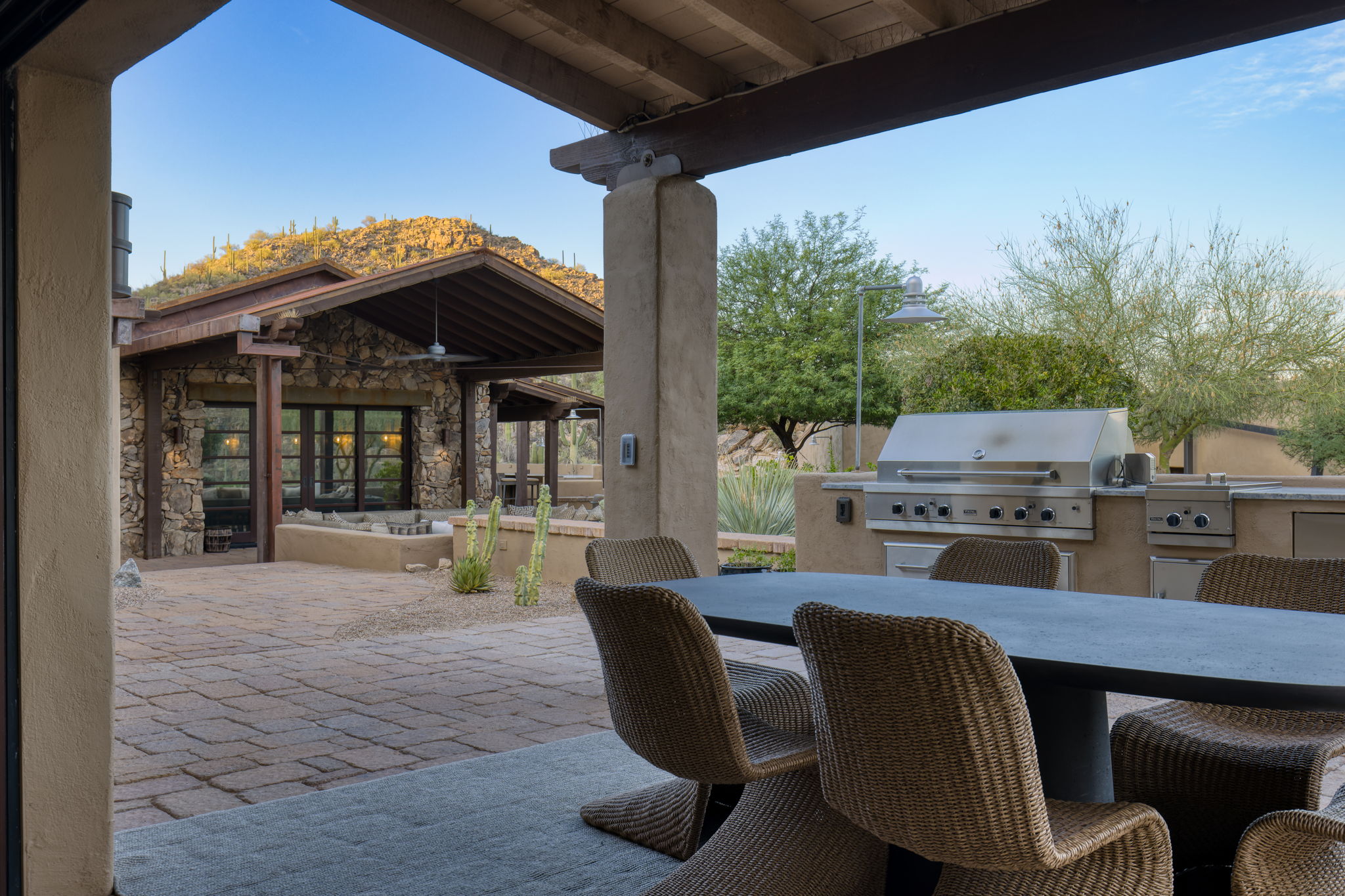 Outdoor dining beneath the ramada