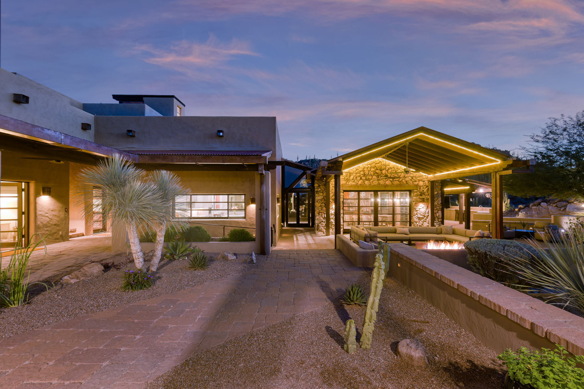 The compound at dusk, arranged across the desert