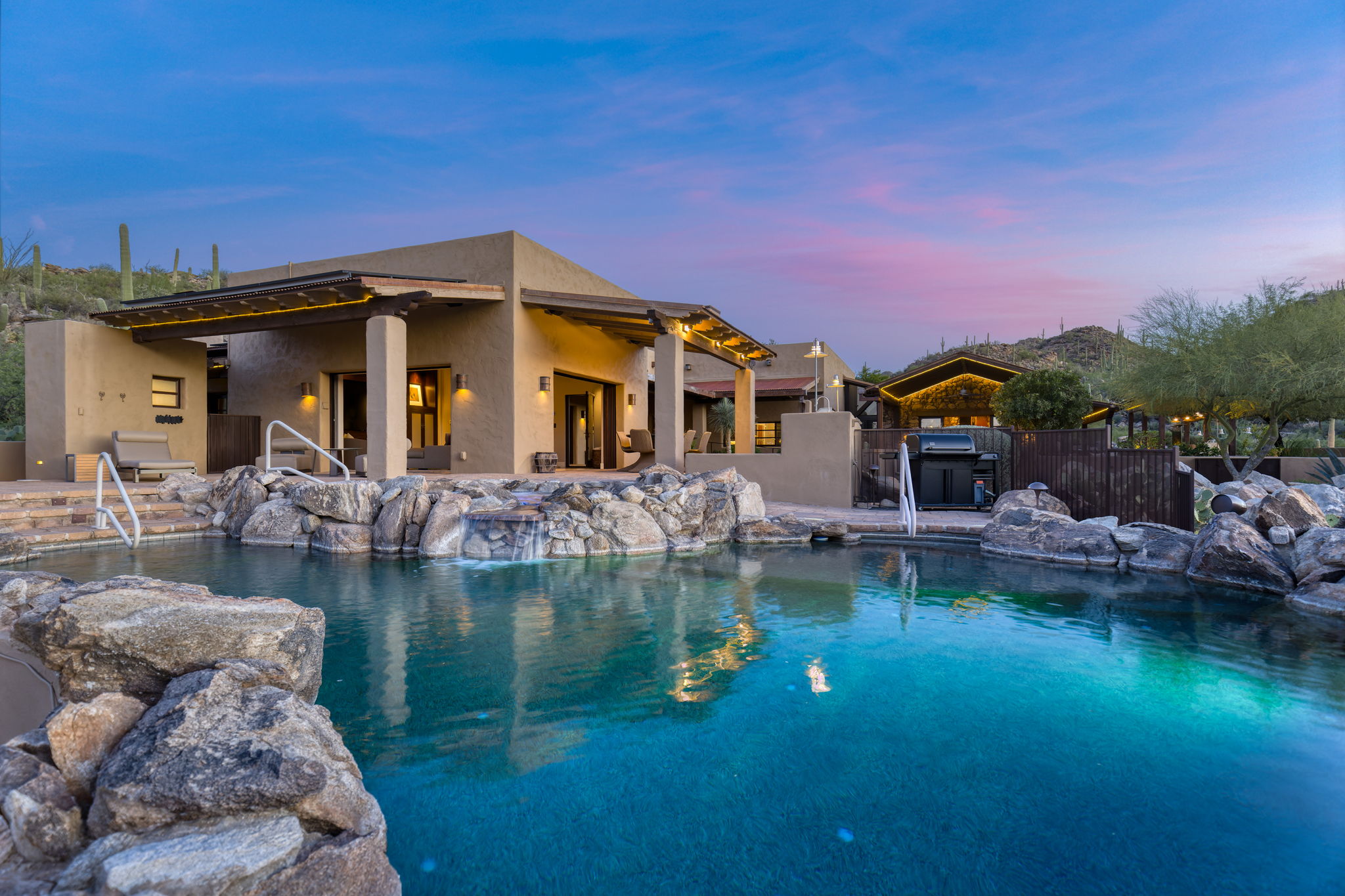Boulders set into the pool's waterline, blurring the edge