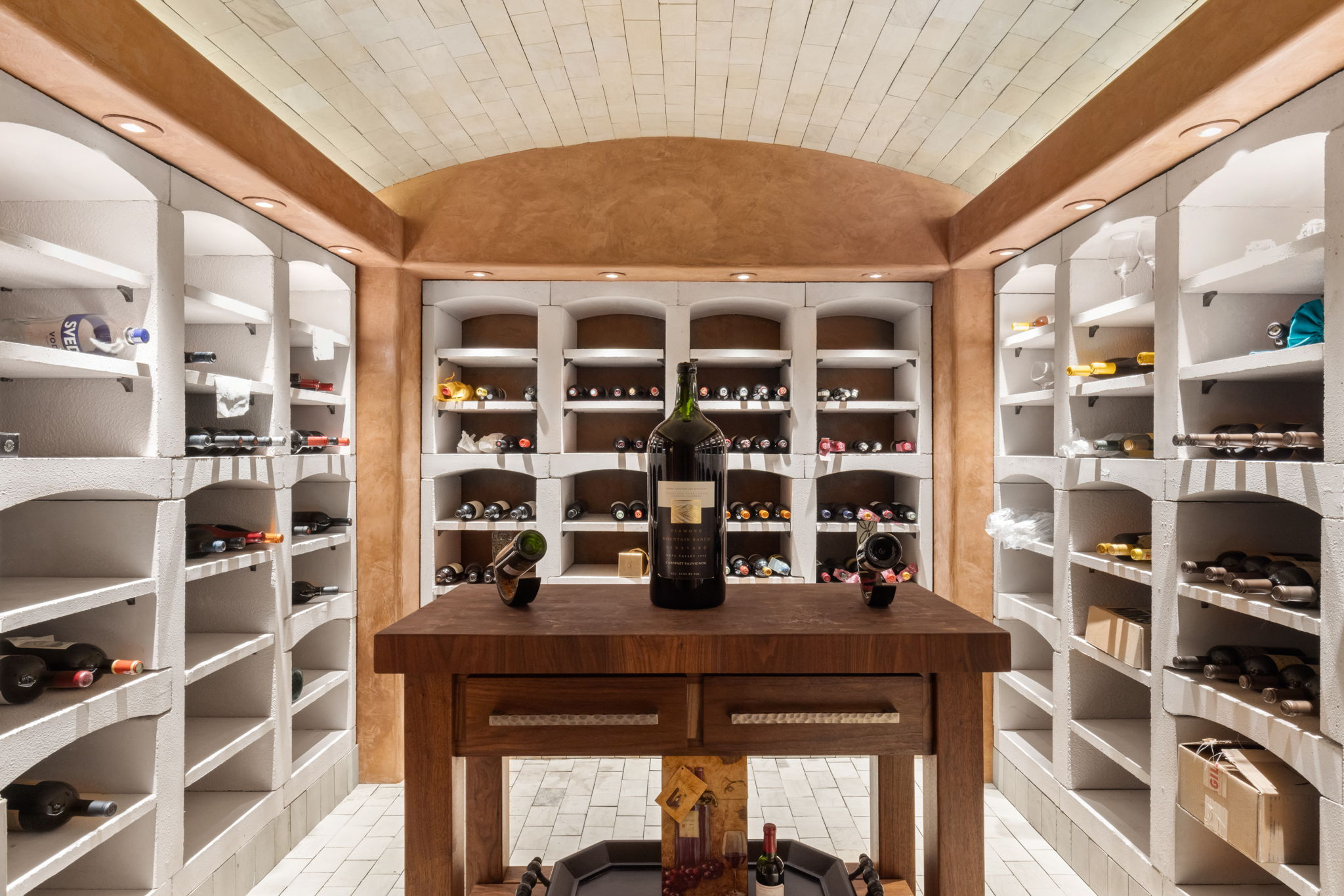The barrel-vaulted wine room with racking on both walls