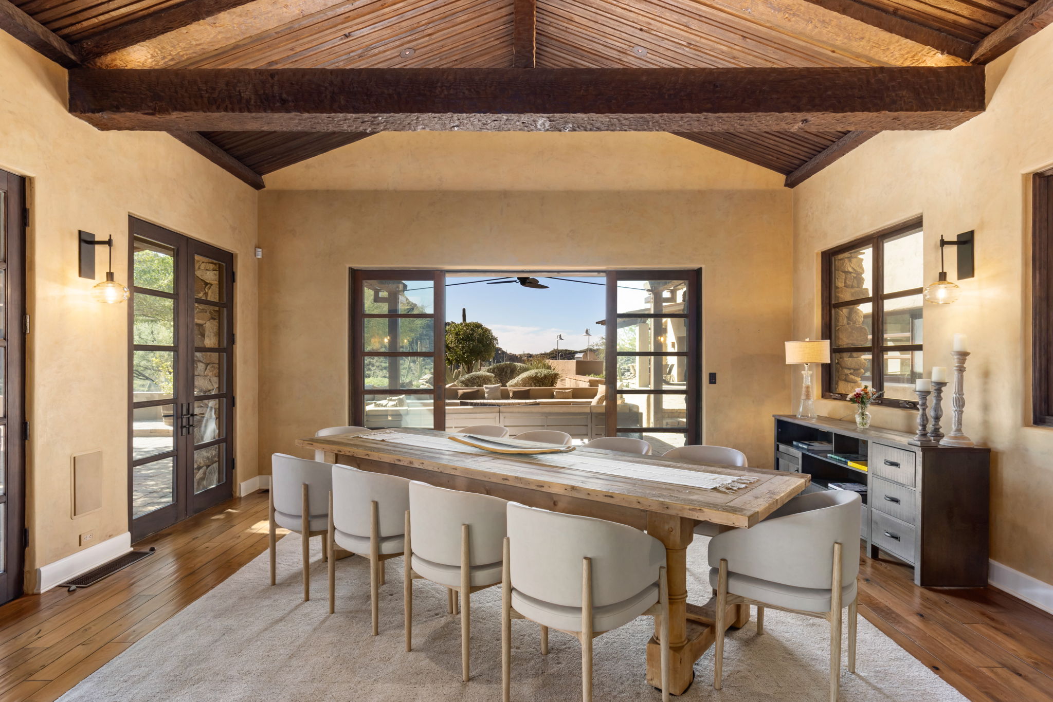 The dining room opening to the mountains
