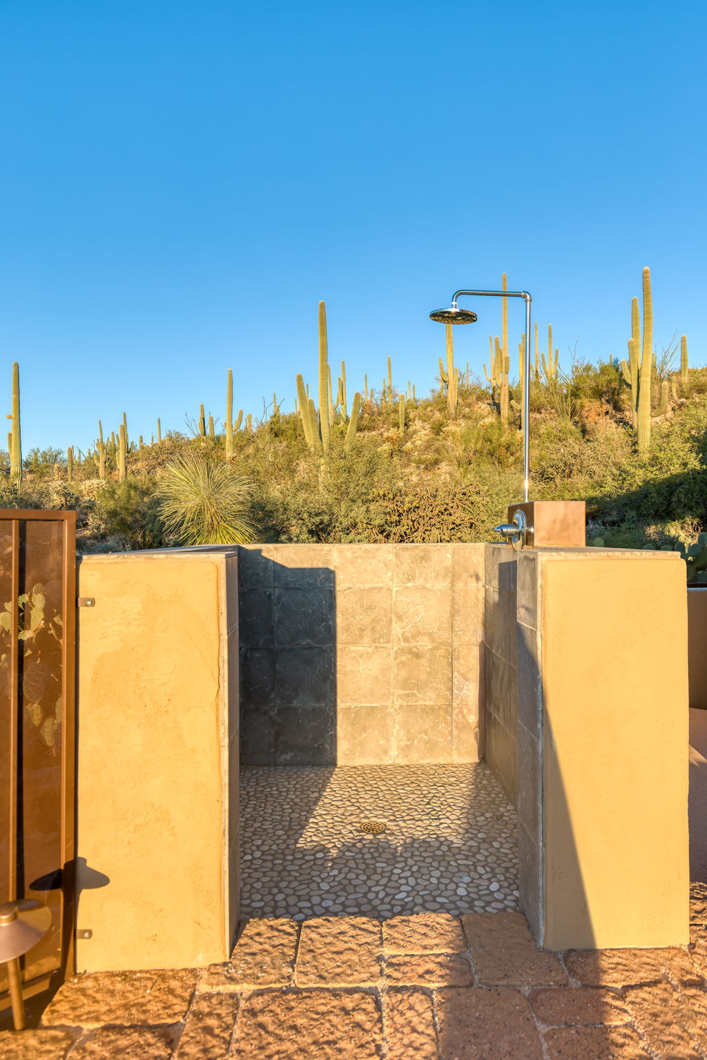 Indoor-outdoor shower open to the desert air